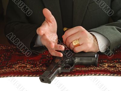 hands of man with a pistol