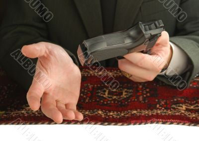 hands of man with a pistol