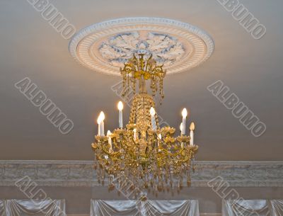 Gold chandelier in old house