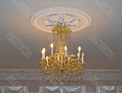 Gold chandelier in old house