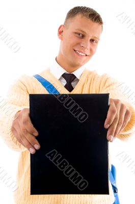 young student showing his book