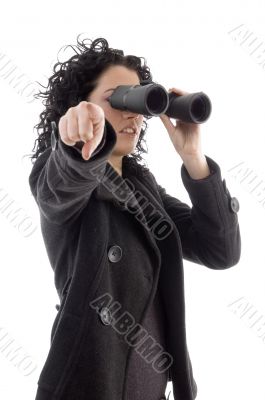 pointing female holding binocular