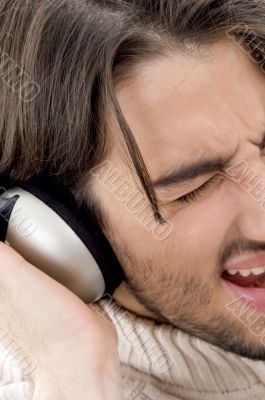 male listening to music on headphone