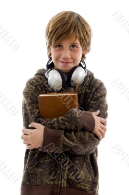 student with books looking at camera