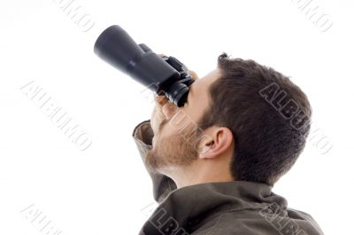 hispanic man looking through binoculars