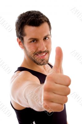 young male with thumbs up