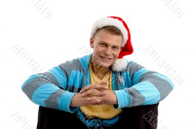 sitting young male with christmas hat