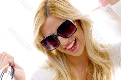front view of happy woman with shopping bags