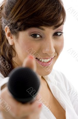 front view of female executive offering microphone
