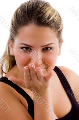 young female giving flying kiss