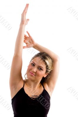 young female stretching her arms