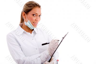 medical professional with writing pad