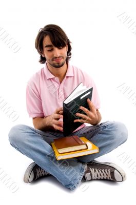 student closing his notebook