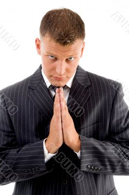 praying professional looking at camera