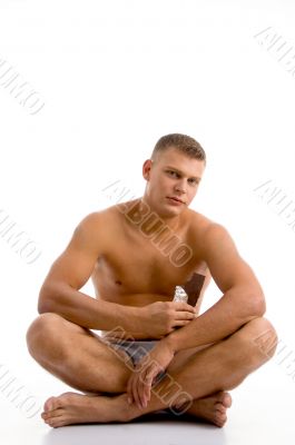 sitting muscular guy with chocolate