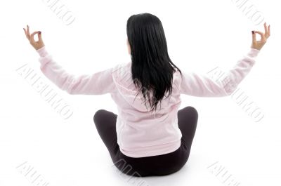 back pose of female in lotus pose