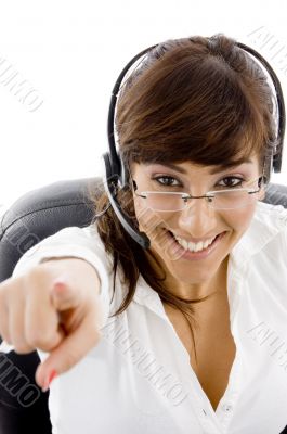 cheerful customer care executive pointing