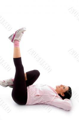 laying exercising woman on white background