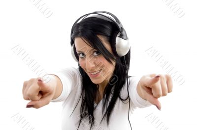 front view of pointing female wearing headphone