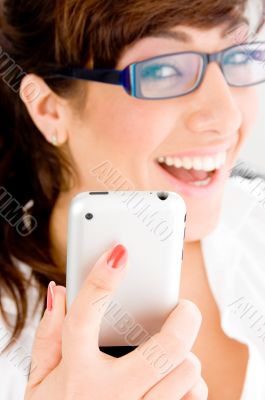 side pose of smiling female holding ipod