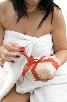 close up of woman posing with scrubber