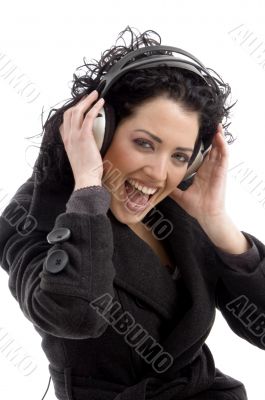 side view of smiling woman wearing headphone
