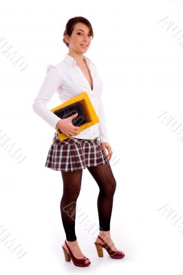 full body pose of smiling young student with books