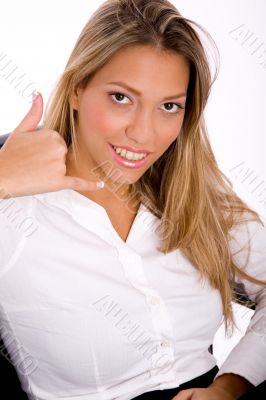 businesswoman showing telephonic gesture