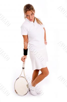 side view of standing player with tennis racket