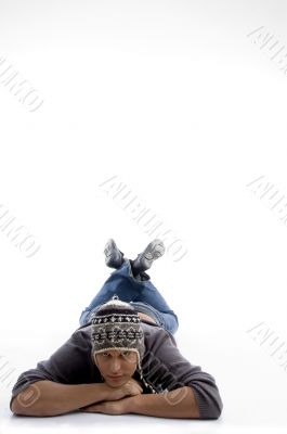 laying man wearing winter hat
