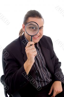 young investigator holding magnifier