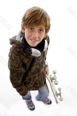 smiling child with skateboard and headphone