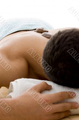 front view of man lying down for spa treatment