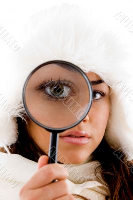 portrait of female holding magnifing glass