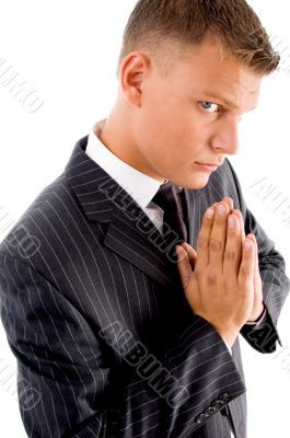praying professional looking at camera