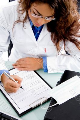  young doctor writing prescription
