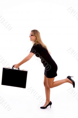 side view of young woman running with briefcase