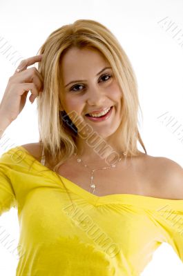 smiling female pointing at her head