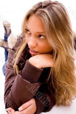 front view of laying young woman