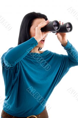 female looking through binocular