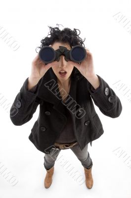 female watching through binocular