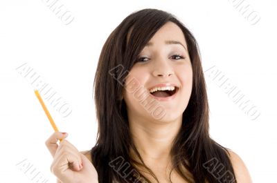 smiling girl with pencil looking at camera
