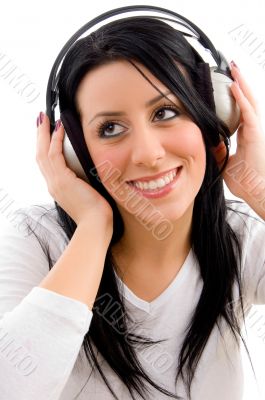front view of happy model listening music