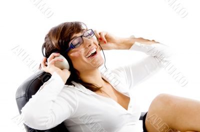 side view of smiling woman listening to music