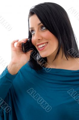 female talking on mobile on white background