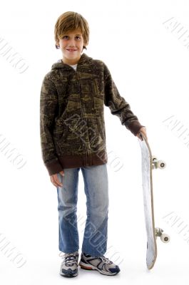 front view of boy holding skateboard