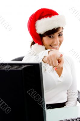 front view of smiling christmas woman pointing
