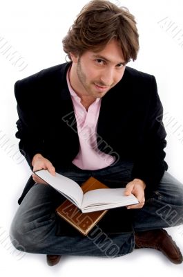 handsome sitting male with books