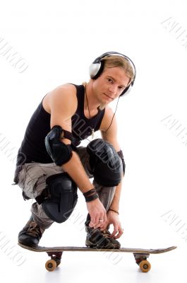 male listening to music on skate board
