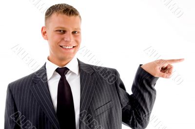 pointing businessman looking at camera